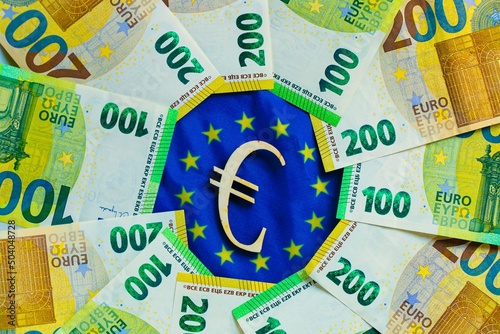 Euro exchange rate. state of the economy and currency of the EU countries. euro bills and the euro sign on the flag of the European Union.