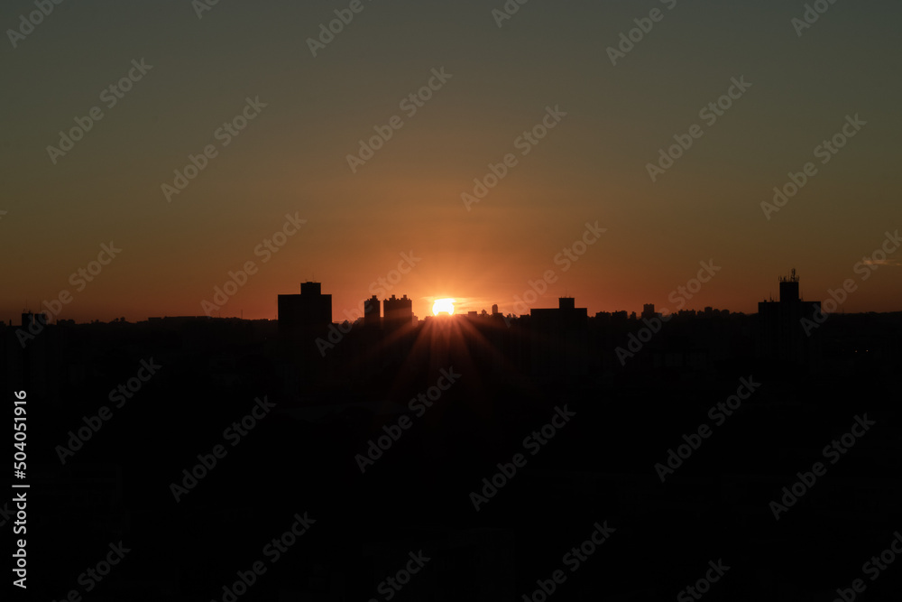 Orange sunset over the city and buildings silhouette in Santo Andre, São Paulo, Brazil - Pôr do sol em Santo André