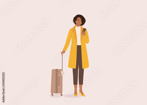 One Black Businesswoman In Yellow Coat Holding Luggage And Looking At Her Mobile Phone. Full Length, Flat Design, Character, Cartoon.