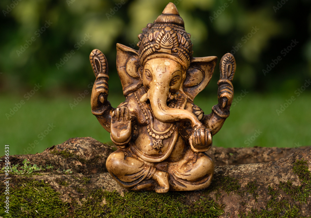 Ganesh Statue Sitting in Garden Ganesh Statue Sitting in Garden