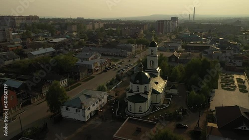 Orthodox cathedral in center of industrial city near river, Vyatskie Polyany photo