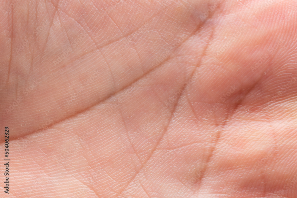 Close-up tan human skin texture background texture of abstract palm line Close-up tan human skin texture background texture of abstract palm line