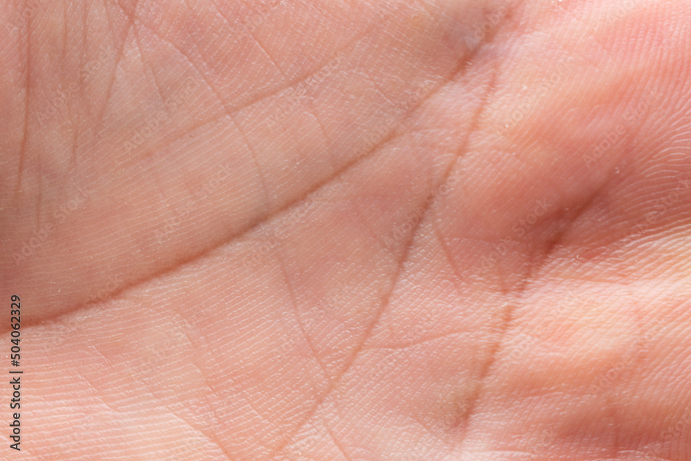 Close-up tan human skin texture background texture of abstract palm line