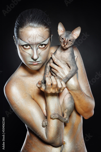 european model in cat make-up and bodyart photo