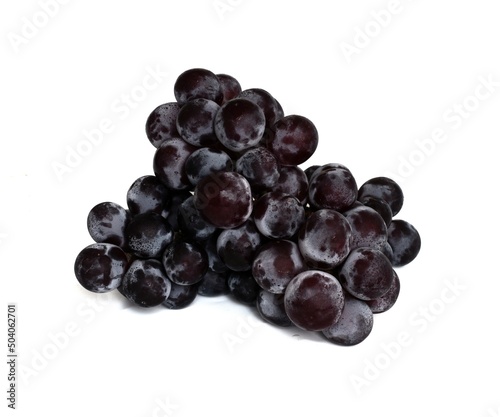 Close-up of sweet black grapes isolated on white background.