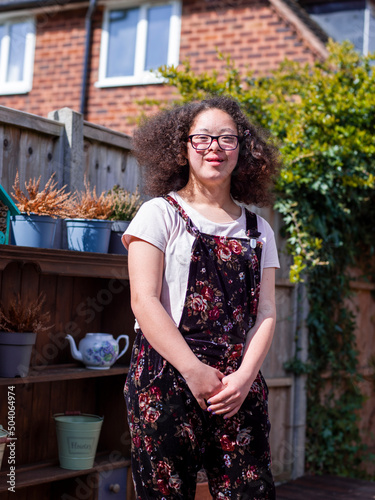 Portrait of girl standing in backyard