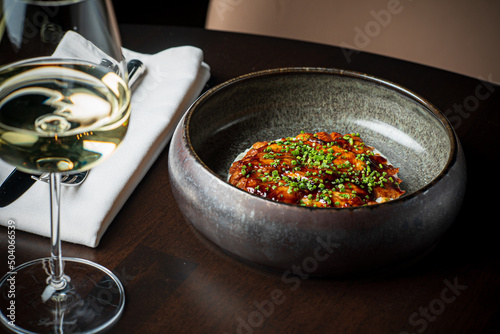 eel carpaccio and white wine photo