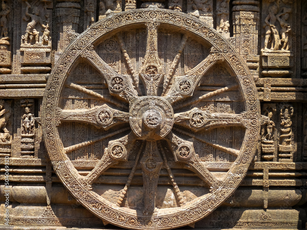 The famous stone chariot wheel engraved in the walls of historic Sun temple in Konark (Odisha, India), a world heritage site.