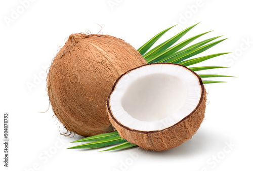 Coconut fruit with cut in half and leaves isolated on white background.