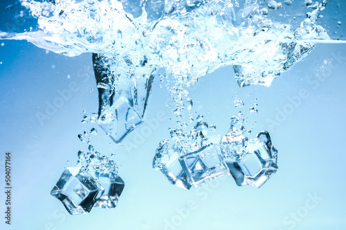 Abstract background image of ice cubes in blue water.