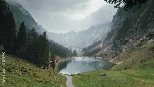 Static panorama time lapse of a beautiful rural lake in the alps of Switzerland