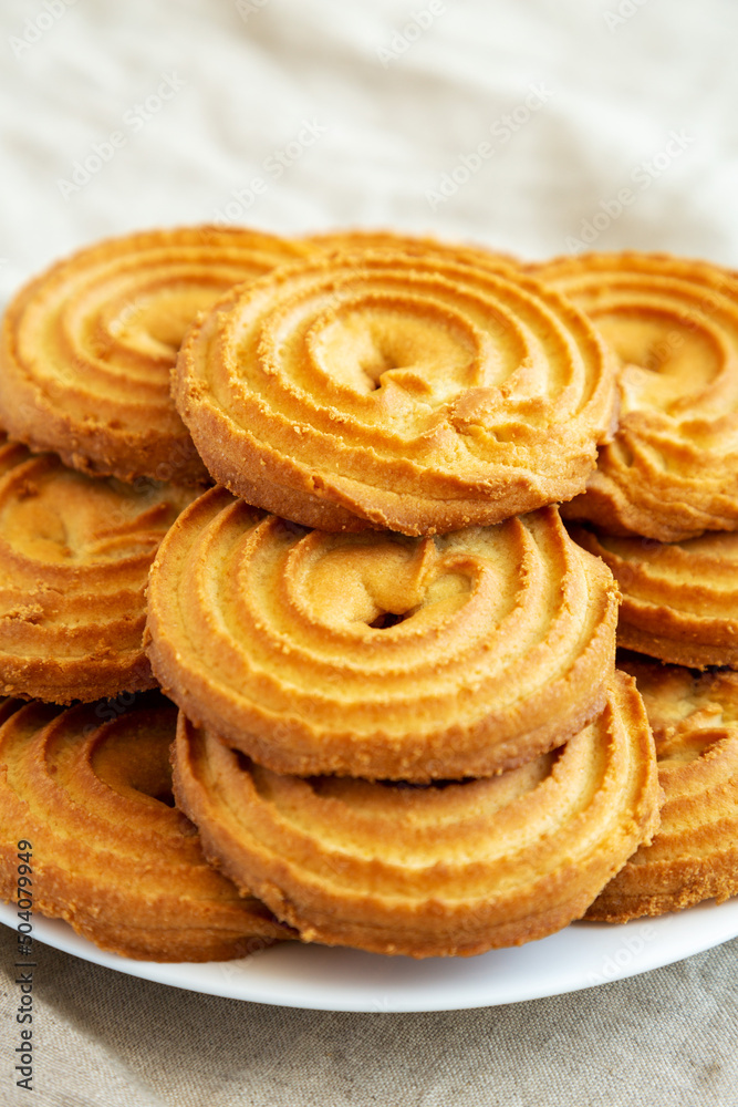 Homemade Sprits Biscuits on a Plate, side view. Close-up. Homemade Sprits Biscuits on a Plate, side view. Close-up.