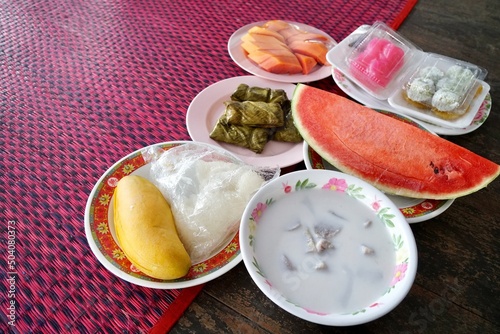 Group of food and fruits on plate preparing to offer food to the monks at noon. traditional and culture of Thailand. make merit at temple. photo