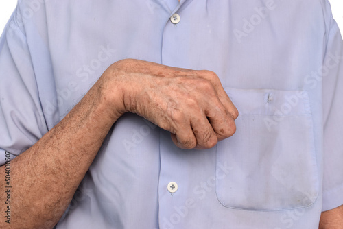 Hand muscle rigidity and finger flexion of Asian man. photo