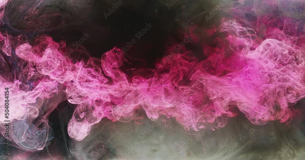 Color smoke cloud. Ink water drop. Explosion fume. Intro reveal transition. Neon pink black smog mix on dark abstract background shot on RED Cinema camera.