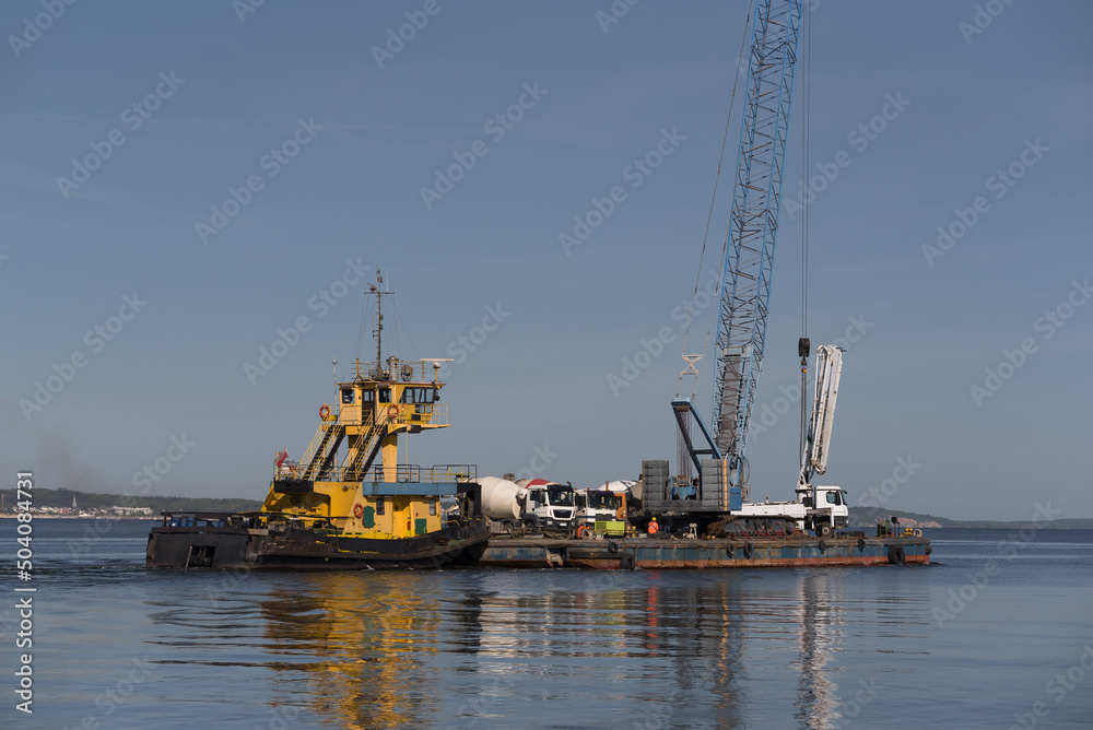 PUSHER TUG AND BARGE - A floating platform with crane for hydrotechnical works and concrete mixer trucks on deck