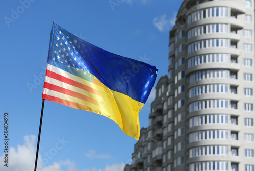 Waving flag in national colors of Ukraine and USA outdoors