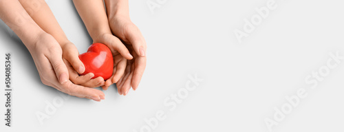 Hands of mother and child h...