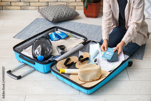 Woman packing immune passpo...