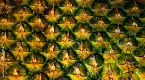 Pineapple bark. Pineapple background. Pineapple skin close up, tropical pattern with copy space.