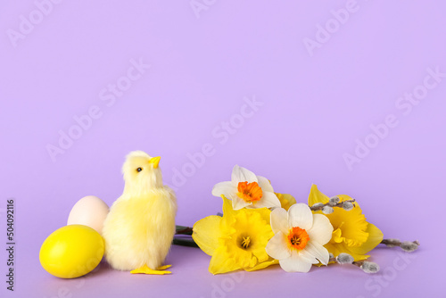 Cute chicken, flowers and Easter eggs on lilac background © Pixel-Shot