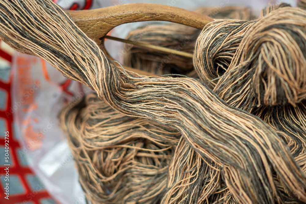 Closeup of old weaving machine, weaving of yarn, thread and thread.