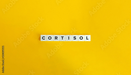 Cortisol Word and Banner. Letter Tiles on Yellow Background. Minimal Aesthetics. photo