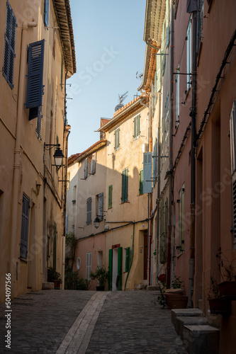 Sunny day in South of France  walking in ancient Provencal coastal town Cassis  narrow streets and colorful buildings  Provence  France