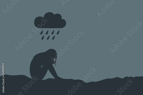 lonely depressed girl sitting alone in the rain
