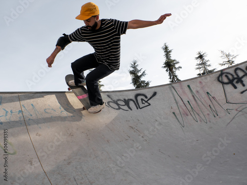 Man conquering the skatepark's ramps