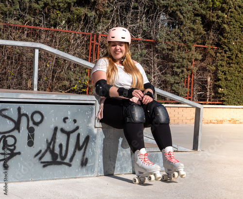 Young woman gracefully skating in the skatepark