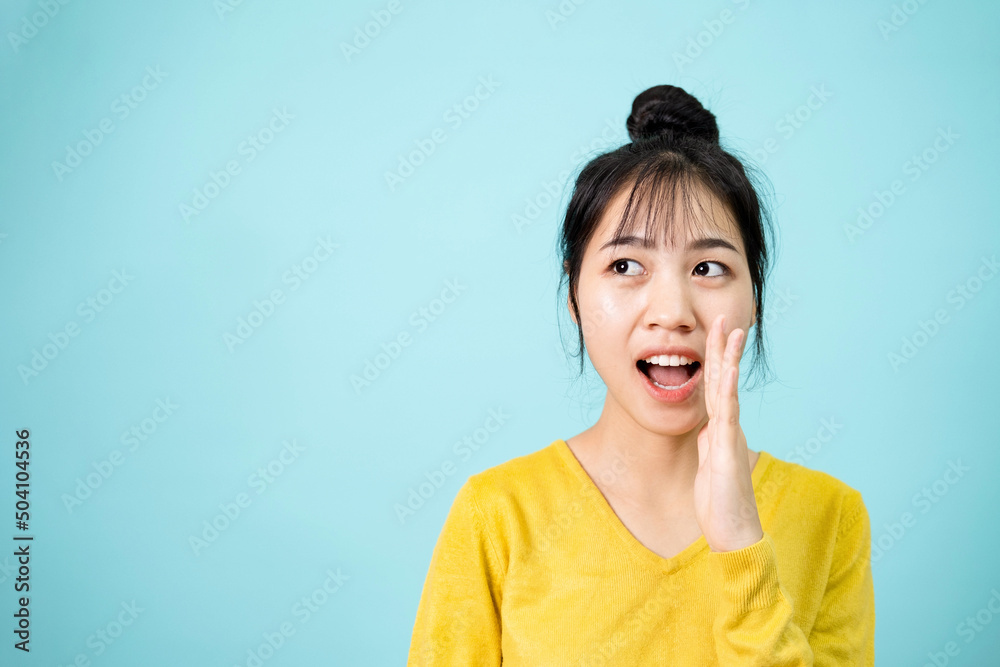 Young woman hand on mouth telling secret rumor. Young woman hand on mouth telling secret rumor.