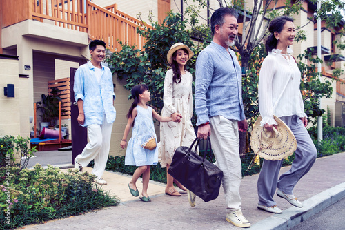 Wallpaper Mural Happy family with a suitcase travel on holiday Torontodigital.ca