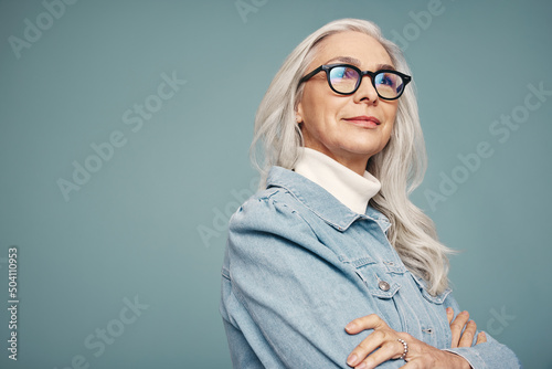 Mature woman looking away thoughtfully in a studio