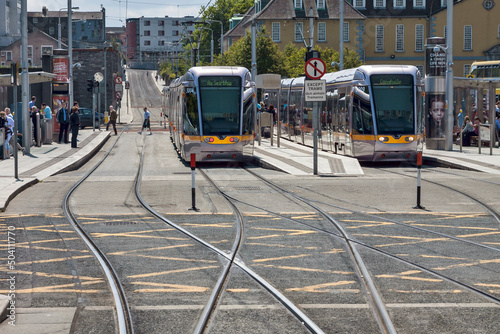 Ireland - Dublin - Two trams stop at the station Heuston of Dublin LUAS tramway red line photo