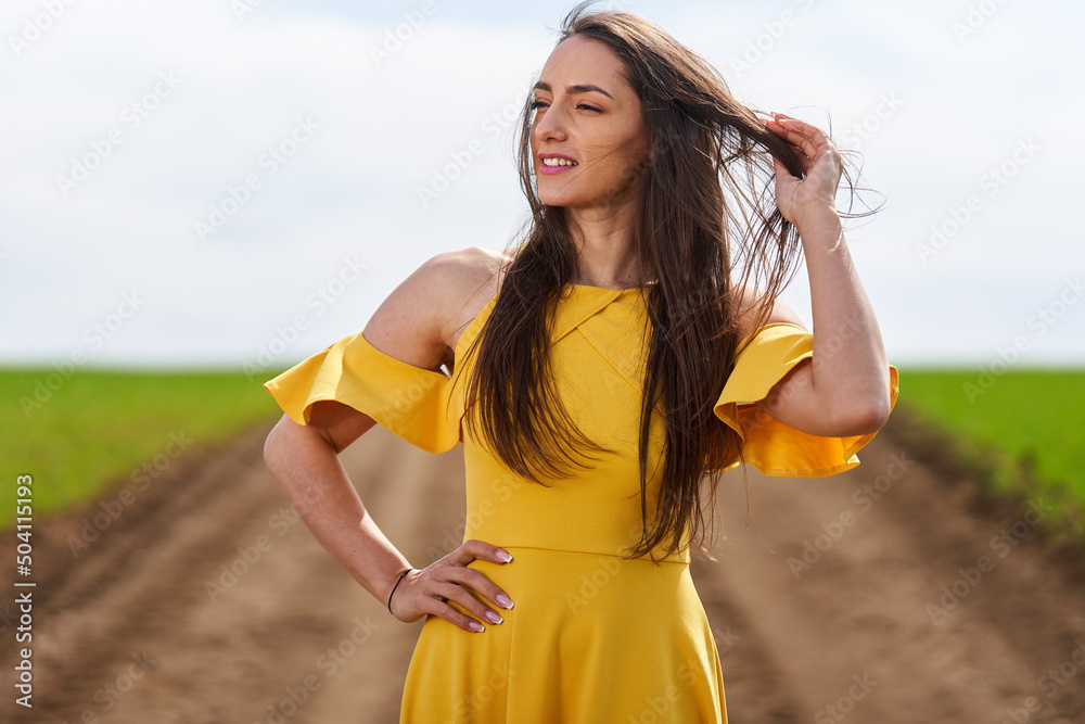 Young woman on a dirt road