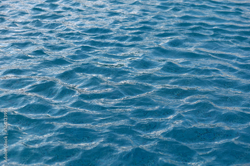 Obraz premium Blue pool water surface with waves. Water background.