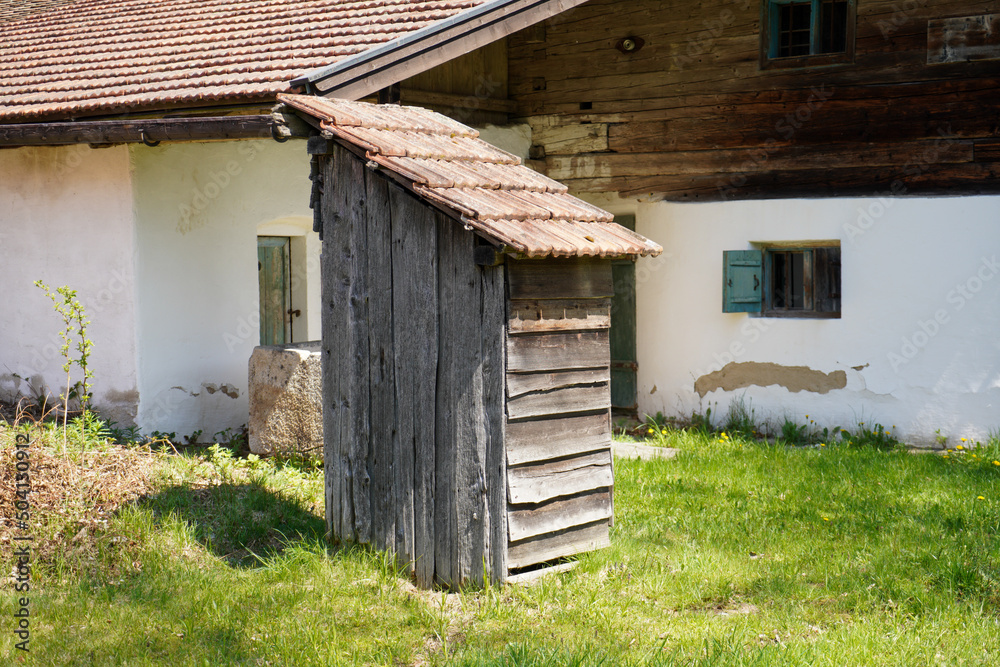 Wooden farmhouse in Bavaria with many details from the roof to wooden windows and doors Wooden farmhouse in Bavaria with many details from the roof to wooden windows and doors