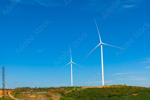 Wallpaper Mural Renewable energy wind turbines windmill isolated on the beautiful blue sky and on the tea fields in Da Lat city, Lam Dong, Viet Nam Torontodigital.ca