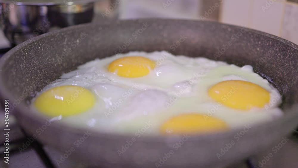 Eggs are fried in a pan. Healthy breakfast concept. Fried eggs Eggs are fried in a pan. Healthy breakfast concept. Fried eggs