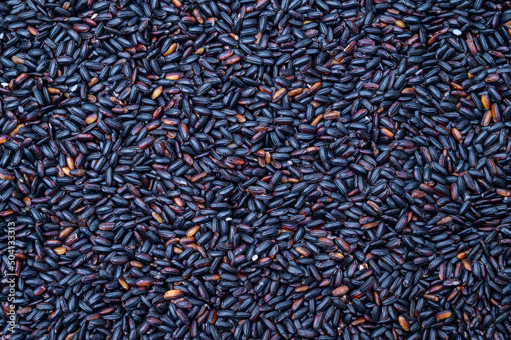 Black rice top view background. Grain background.