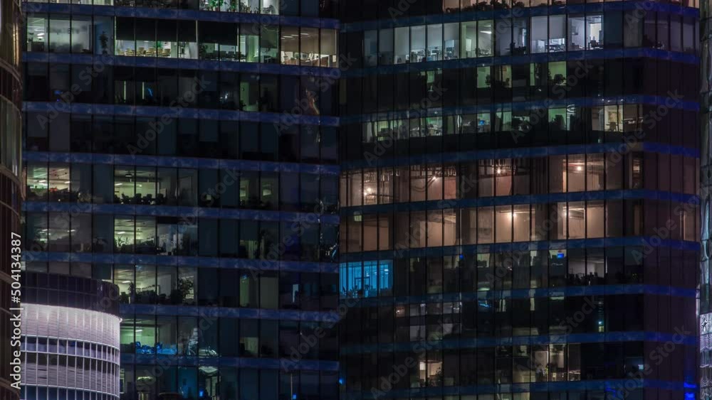 Close up view to glowing office windows in Skyscrapers International Business Center of City at night timelapse from top Close up view to glowing office windows in Skyscrapers International Business Center of City at night timelapse from top