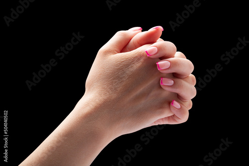 Beautiful female hands on isolated black background