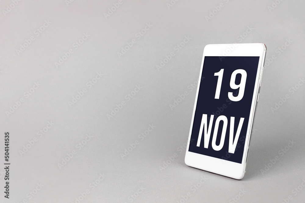 November 19th. Day 19 of month, Calendar date. Smartphone with calendar day, calendar display on your smartphone. Autumn month, day of the year concept. November 19th. Day 19 of month, Calendar date. Smartphone with calendar day, calendar display on your smartphone. Autumn month, day of the year concept.