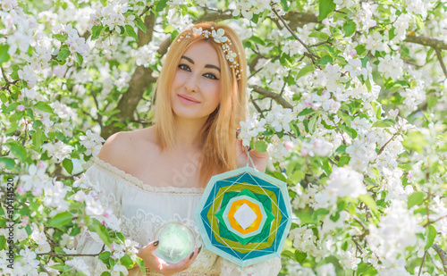  Woman with mandala and magic ball. Energy reiki concept, clean from negative energy photo