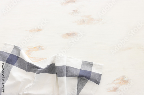 top view of vintage tablecloth with over white wooden background