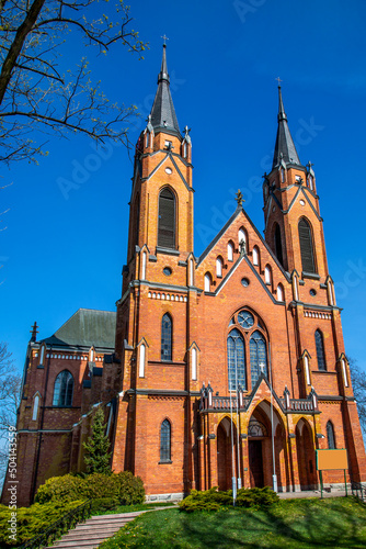 The photos show a general view of the Catholic Church of the Nativity of the Blessed Virgin Mary in the village of Rajgród in Podlasie, Poland, built in the neo-Gothic style in 1905-1912.