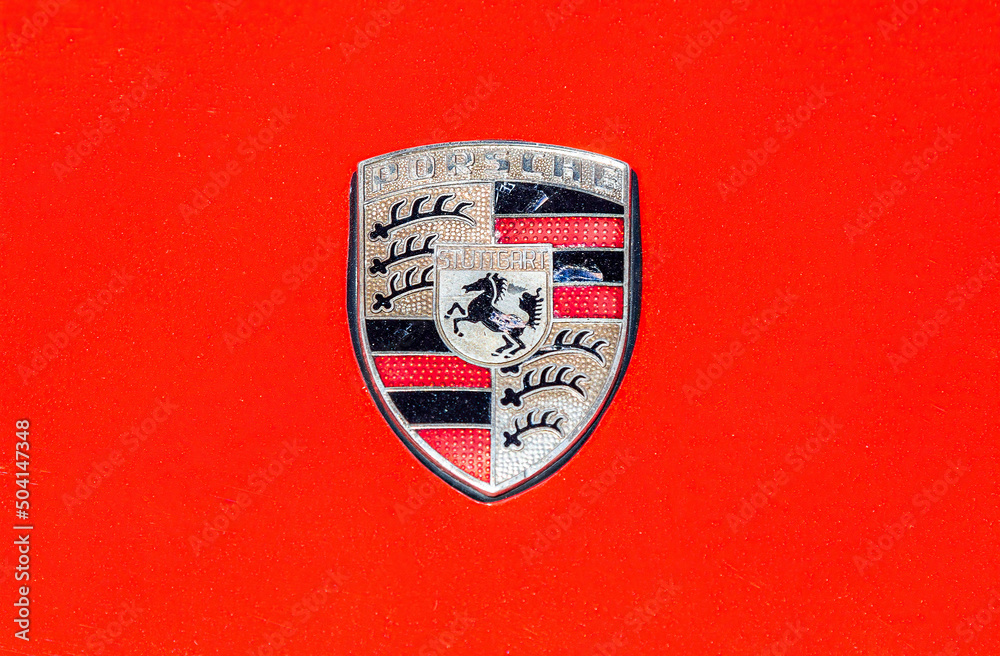 Porsche automobile logo on the red car Stock Photo Adobe Stock