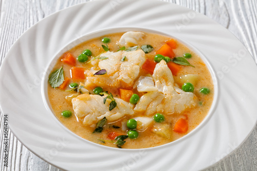 white fish chowder with green peas, potatoes