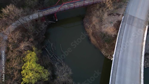 Aerial footage of Old Alton Bridge in Lantana Texas.  Camera approaches from the north. photo